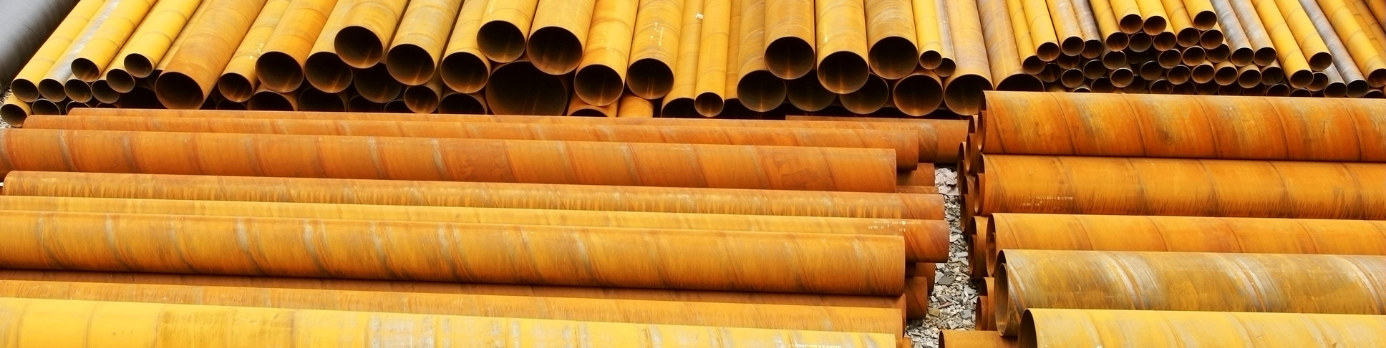Industrial steel pipes stacked in rows