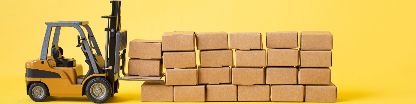 Yellow forklift with stacked cardboard boxes against yellow background